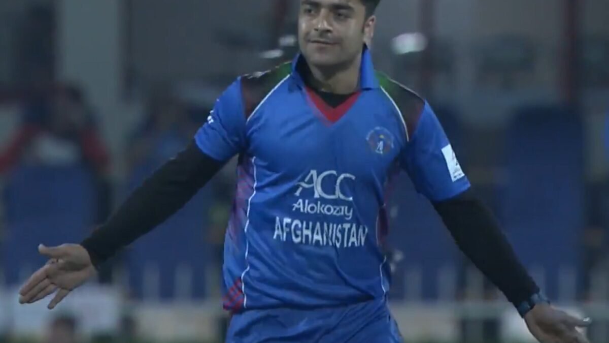 Afghanistan leg-spinner Rashid Khan celebrating a wicket in a blue Afghanistan shirt