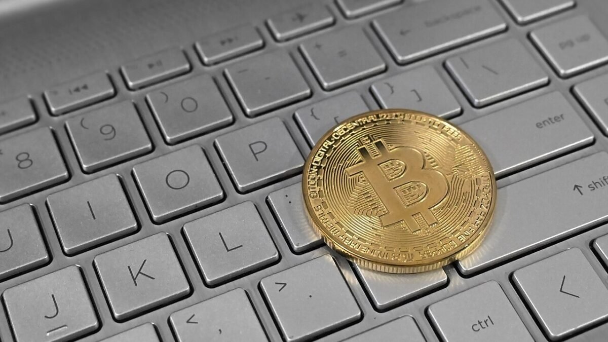 A Bitcoin token on a laptop keyboard