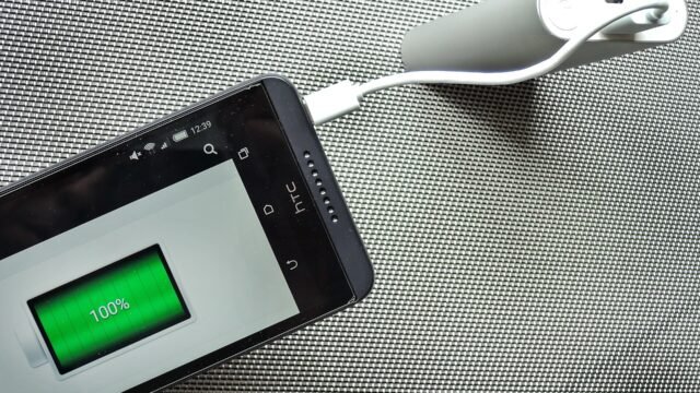 a power bank charging a phone.