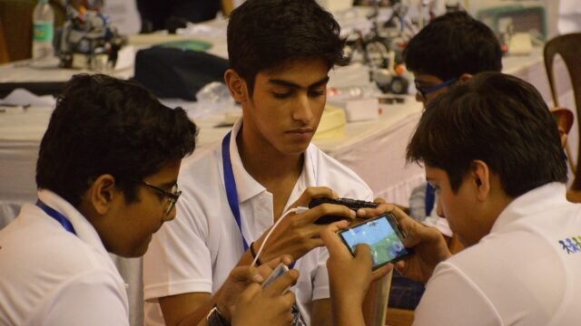 Students playing a game on a smartphone