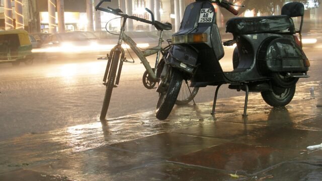 A rain-soaked Delhi street at night