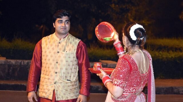 Karva Chauth ritual with a sieve and diya