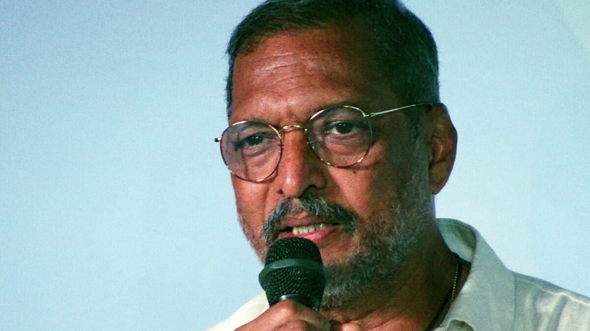Nana Patekar speaking into a microphone at IFFI Goa in 2017