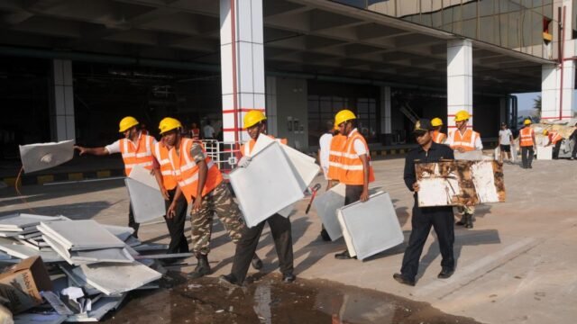 Navy and NDRF personnel clearing debris at Visakhapatnam airport